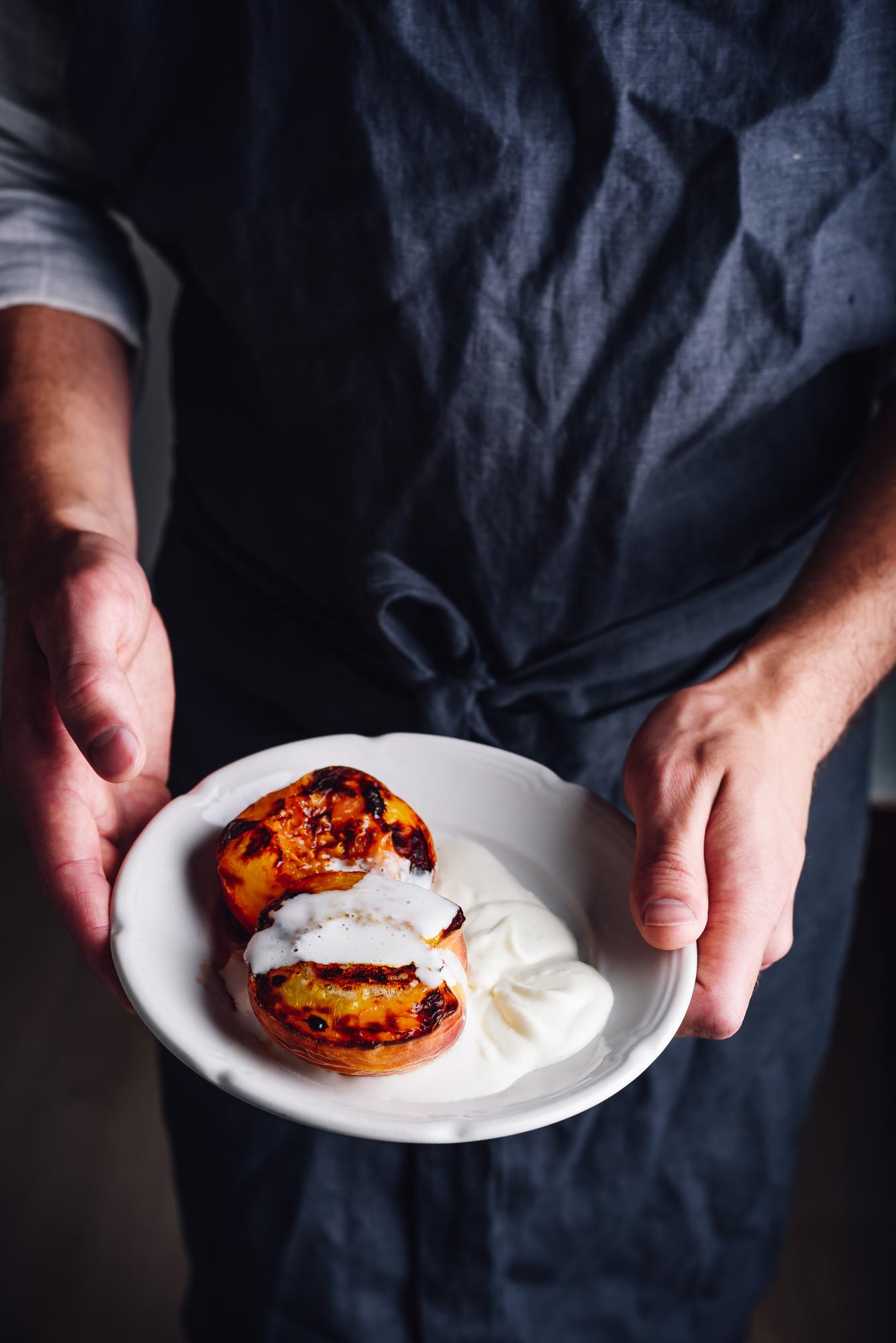 Chef demonstrating plating a modern dish